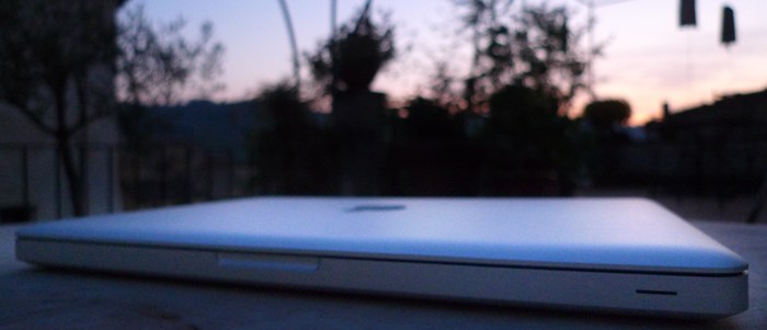 My Mac Book Pro sitting on a table in the terrace.